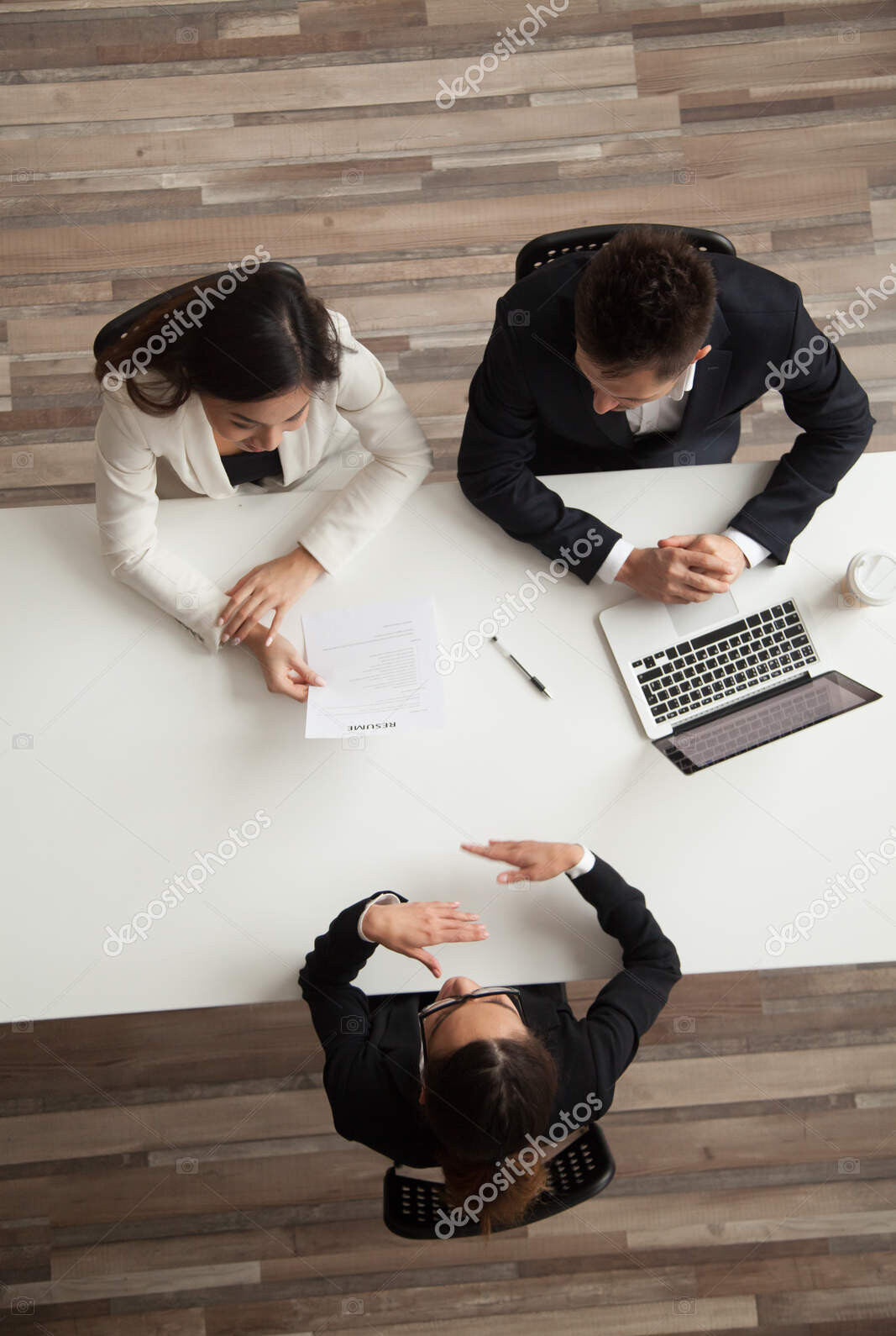 female vacancy candidate answering questions at job interview, t